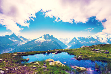 Fantastic landscape with reflection of mountains in the lake on the background of Mont Blanc,...