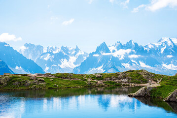 Naklejka na ściany i meble Fantastic landscape with reflection of mountains in the lake on the background of Mont Blanc, French Alps. (Harmony, tourism, meditation - concept)
