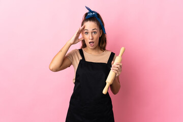Young woman holding a rolling pin has realized something and intending the solution