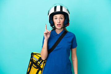 Young caucasian woman with thermal backpack isolated on white background thinking an idea pointing the finger up