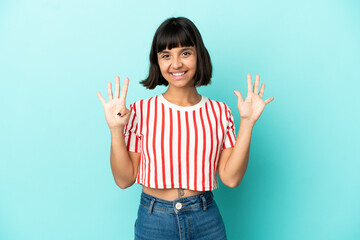 Young mixed race woman isolated on blue background counting nine with fingers