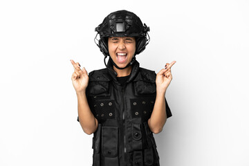 SWAT woman isolated on white background with fingers crossing