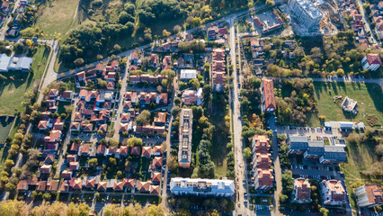 Aerial view of suburban houses in new modern development area. Small city on aerial view. Scenic seasonal landscape from above aerial view of a small town in countryside Pancevo, Serbia