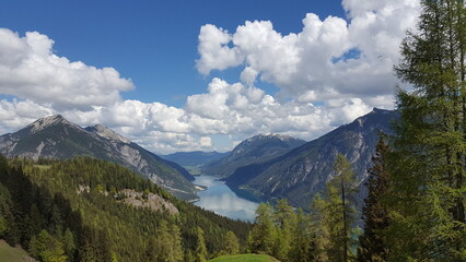 Achensee view with mirror of the sky and cloudy