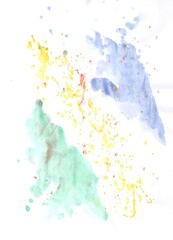 Blue, yellow and green watercolor paint stains on white papper 