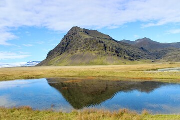 iceland mountain green and lake mirroe