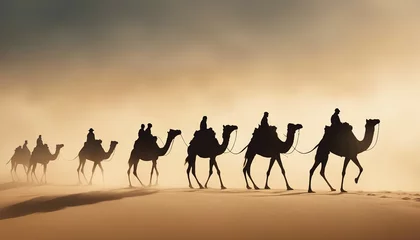 Foto auf Leinwand side view of silhouettes of camels and their owners moving in single file in a sandstorm in the desert  © abu