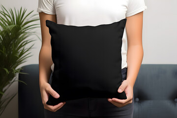 Boy is holding Black Pillow in hands, Pillow mockup template