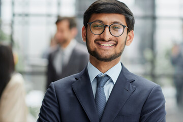 Fototapeta premium Handsome young business man standing confident in the office
