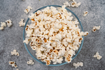 Salted popcorn in glass bowl