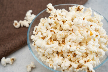 Salted popcorn in glass bowl