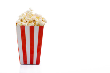 Popcorn in red and white striped paper box isolated on white background