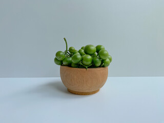 Fruit of Solanum nigrum, the European black nightshade or leunca, isolated on white background