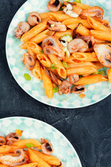 Macaroni with octopus pieces.
