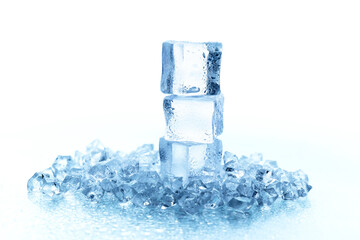 Many beautiful large pieces of ice with drops of water on a light background.