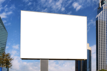 A large information display for outdoor advertising is installed on the street near the road against the backdrop of skyscrapers.