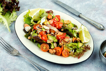 Vegetable salad with seafood.