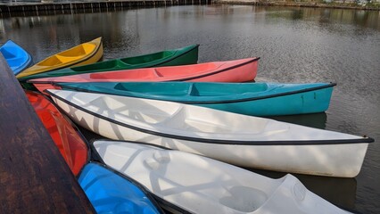 
Colorful canoes floating on the dock