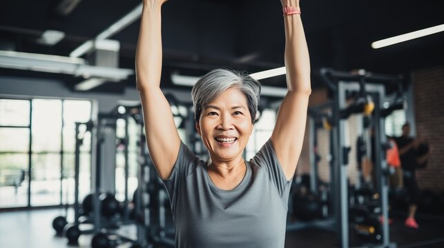 Asian Senior Female Fitness Instructor In The Gym