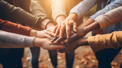 Unified Strength: Group of People Stacking Hands Together in Solidarity