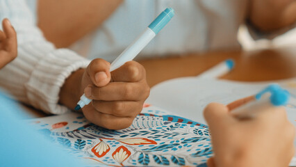Panorama shot of diverse student hand drawing and coloring by using marker at drawing book. Closeup...