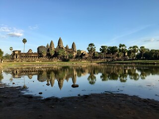 Fototapeta premium Reflection of Angkor Temple in a serene pond. Cambodia