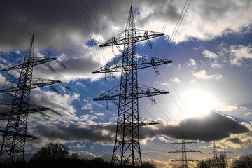 a high voltage line in the evening sun