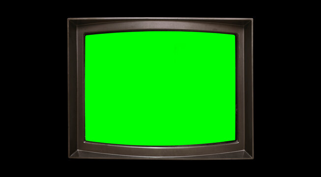 Retro television with chroma key green screen for designer on black background. TV screen frame in a dark room