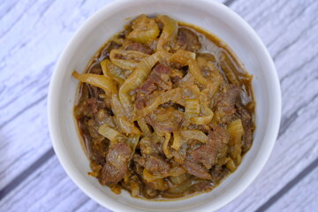 beef teriyaki. Teriyaki is a way of cooking Japanese food that is heated or grilled and coated with soy sauce and flavored sake, mirin, or sugar. Japanese food.