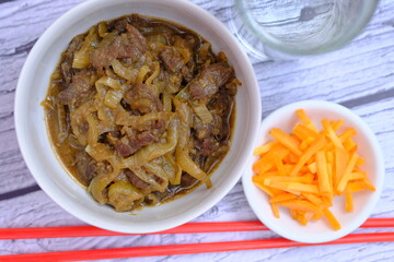 beef teriyaki. Teriyaki is a way of cooking Japanese food that is heated or grilled and coated with soy sauce and flavored sake, mirin, or sugar. Japanese food.