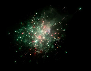 Fototapeta na wymiar bright red and green firework in night sky