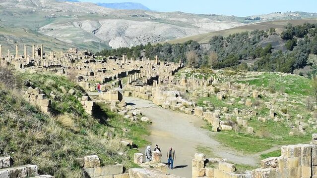 Tourists walking in the ancient Roman town of Djemila. Setif, Algeria. UNESCO World Heritage Site.