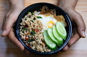 Chicken basil fried rice and fried egg, Thai street food