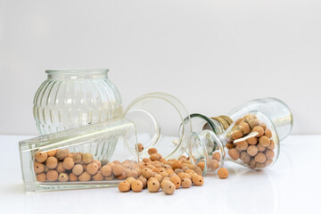 Lightwieght expanded aggregate balls with glass pots and vases on white isolated background