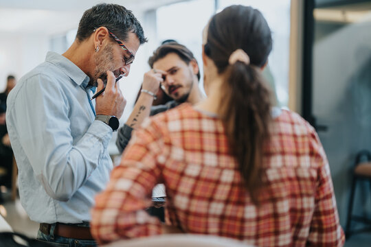 Focused team engaging in problem solving at the creative office space.