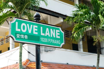 Love Lane street sign in George Town, Penang, Malaysia with surrounding building as background.