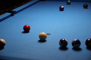 Billiard table with cue and ball at the local bar.  Columbus, Ohio.