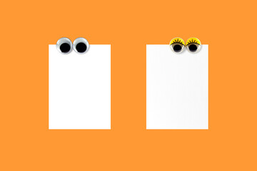 male and female eyes fridge magnet attached on note paper isolated on orange, lover write messages...