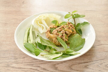 Thai spicy chop pork and slice skin with liver salad on plate