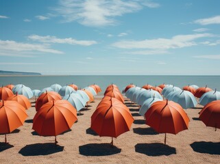 Fototapeta premium A colorful cluster of umbrellas stands tall against the blue sky, providing shade and style on the sandy beach while fluffy clouds float lazily overhead