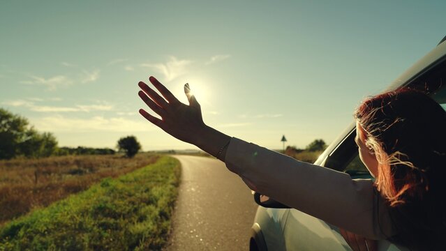 girl rides car with her hand out window, sun glare sunset, wind face, summer vacation mood, people travel, wind freedom sunset, hand wind freedom, girl looking out car window catching wind with hand
