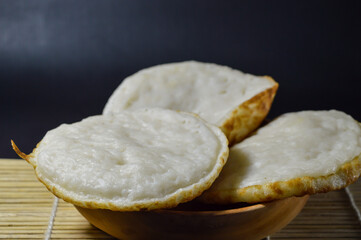 Serabi, Indonesian traditional pancakes, made of rice flour, flour and coocnut milk. Serve with palm sugar sauce.