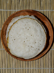 Serabi, Indonesian traditional pancakes, made of rice flour, flour and coocnut milk. Serve with palm sugar sauce.