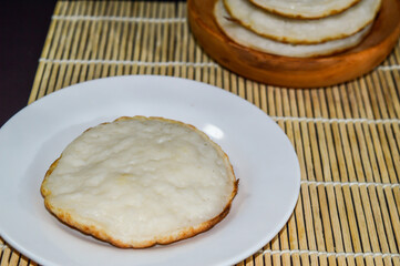 Serabi, Indonesian traditional pancakes, made of rice flour, flour and coocnut milk. Serve with palm sugar sauce.