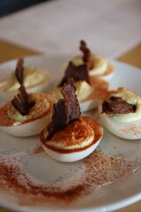 Unique deviled eggs on a plate at a table at a restaurant in downtown Columbus, Ohio.