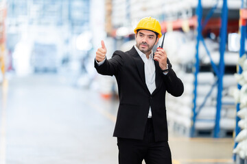 In the plastic and steel industries American male engineer owns a business Praise your subordinates' work by giving them a thumbs up and pressing "Like". in the warehouse Wear a safety helmet and suit