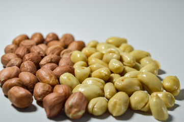 Kacang goreng or fried peanuts. Indonesian snacks. Isolated on a white background. Selective focus