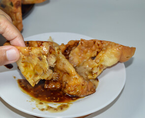 Batagor siomay Bandung, is a street food that is very popular in Indonesia, is one of the local foods. Served with spicy peanut sauce.