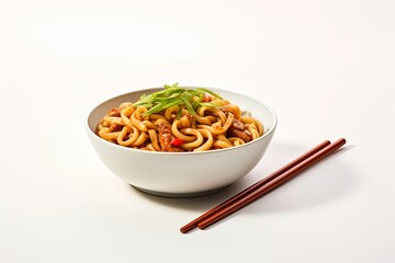 Minimalist composition featuring a bowl of stir-fried yaki udon noodles on a clean, white background