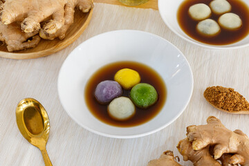 Stuffed Glutinous Rice Balls with Sesame in Sweet Ginger Soup